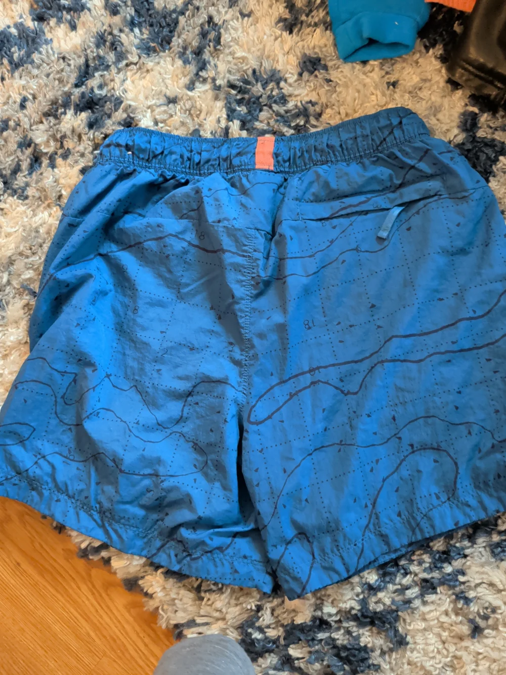 Nike Blue Athletic Shorts with Orange Accent
